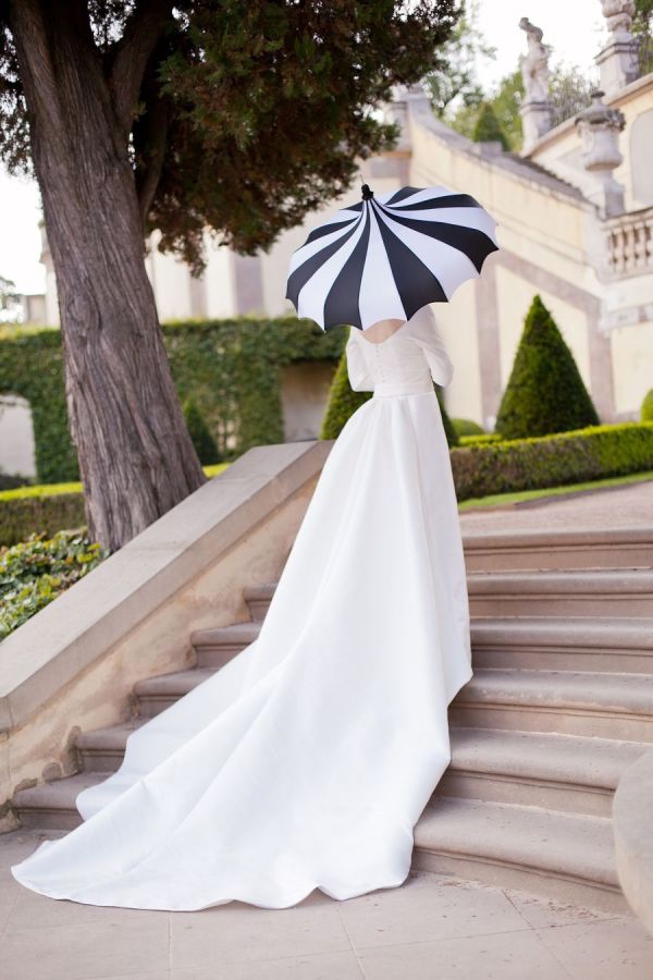 Bride with striped umbrella