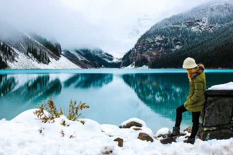 Woman by lake, winter