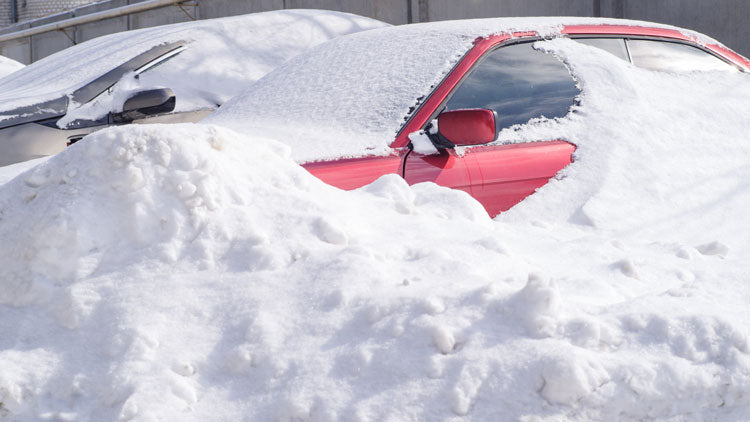 Snow covered car - emergency car kit