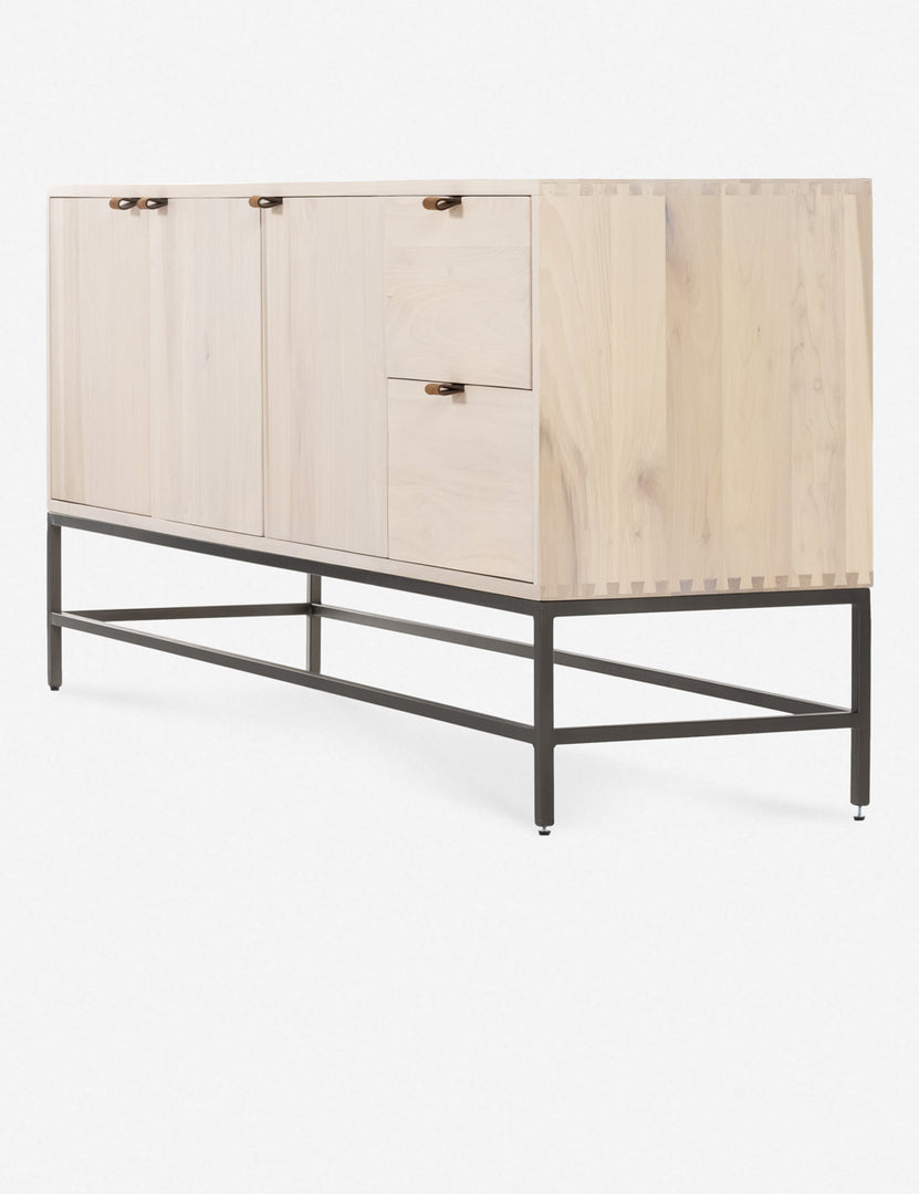 Right side view of the Rosamonde natural wood sideboard with brown leather pulls and a metal base