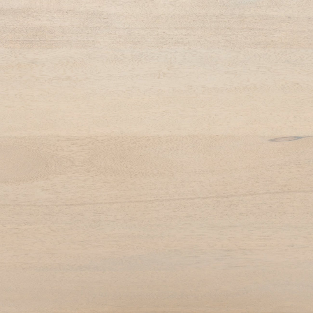 Detailed view of the natural mango wood on the Philene sideboard with cane doors