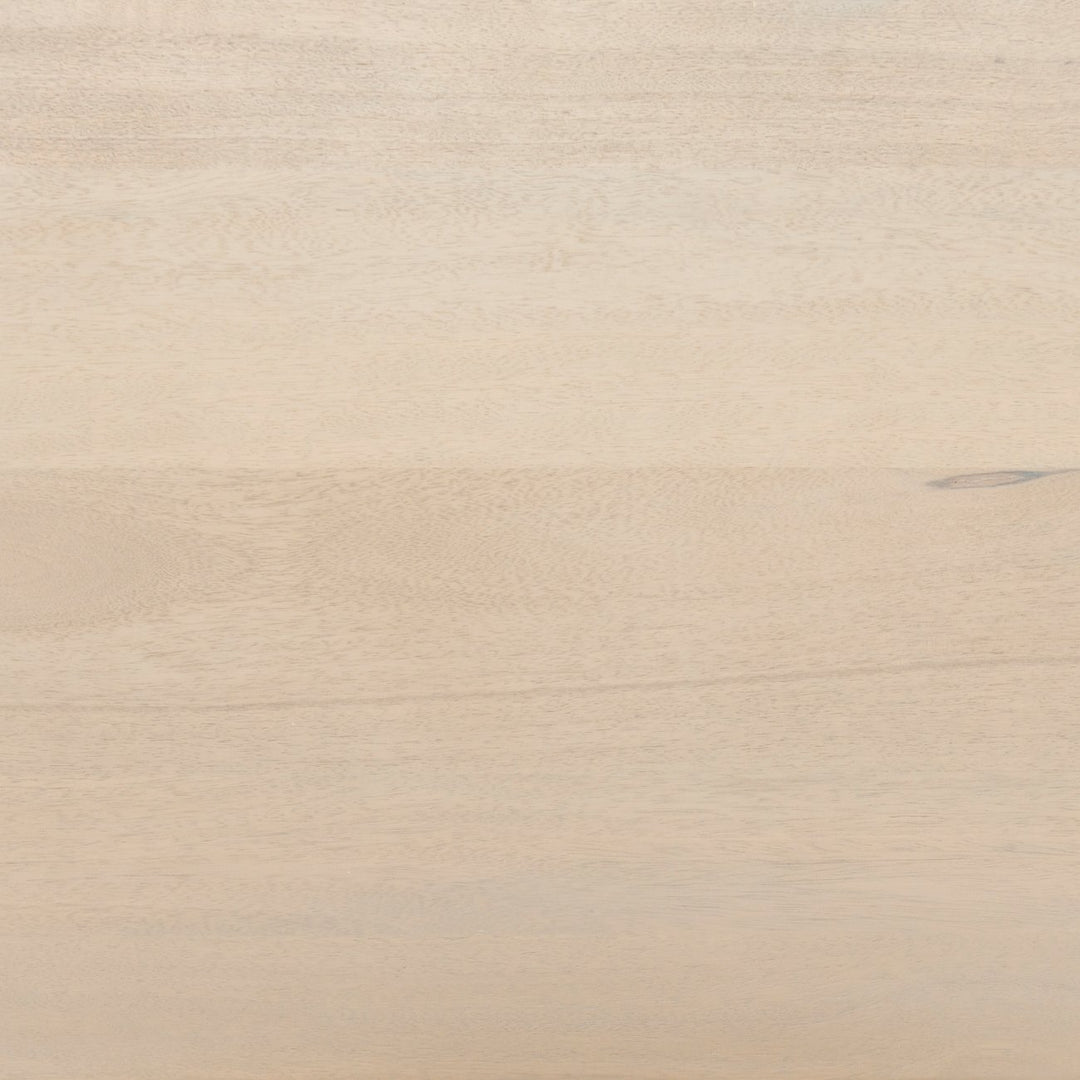 Detailed shot of the whitewashed mango wood on the Hannah whitewashed mango wood cabinet with cane doors