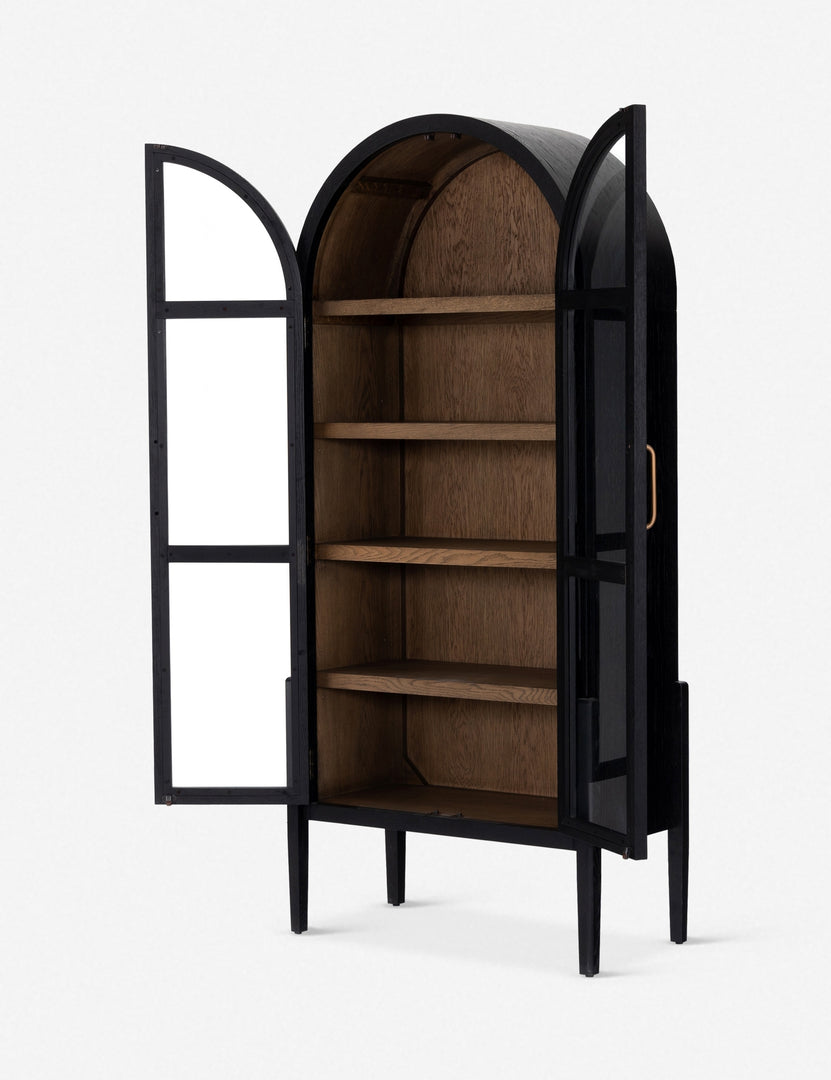Angled right view with open doors on the Apolline black wooden arched curio cabinet with gold door handles