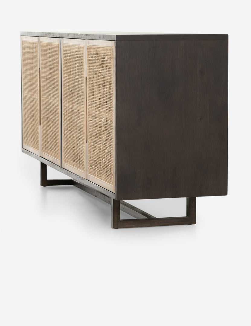 Angled side view of the Margot black natural mango wood sideboard with cane doors.