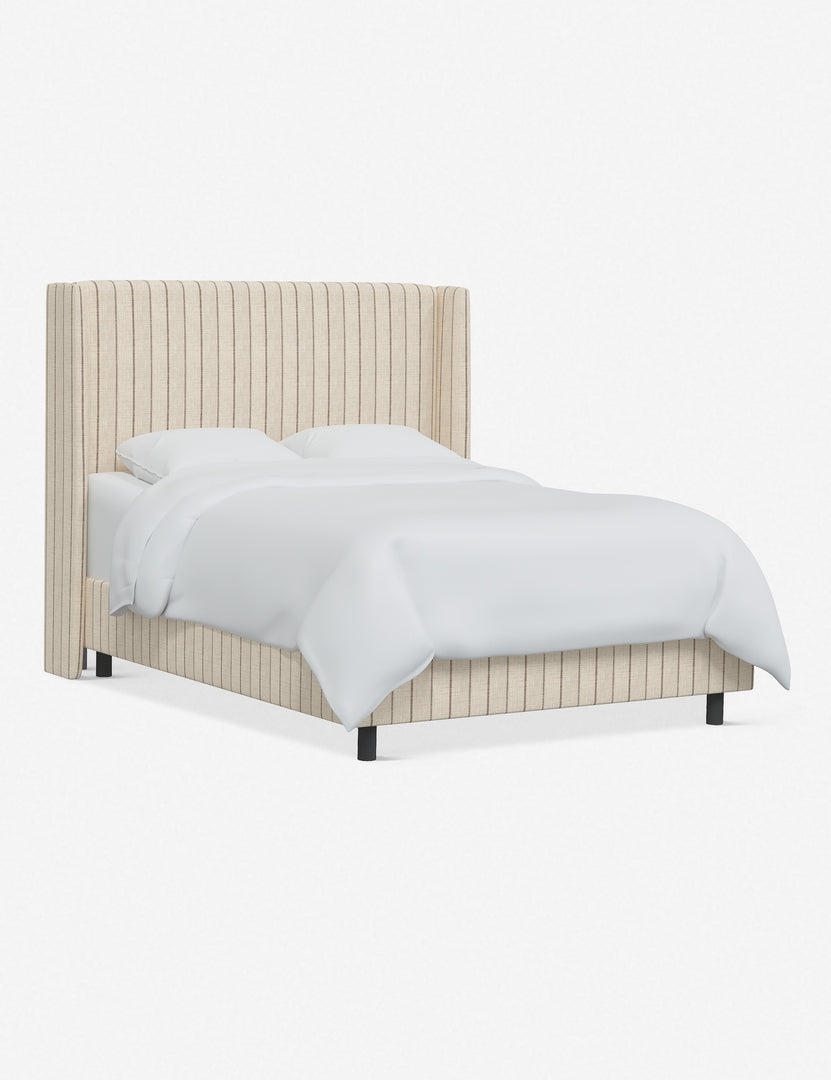 Angled view of the Adara natural stripe linen upholstered bed.