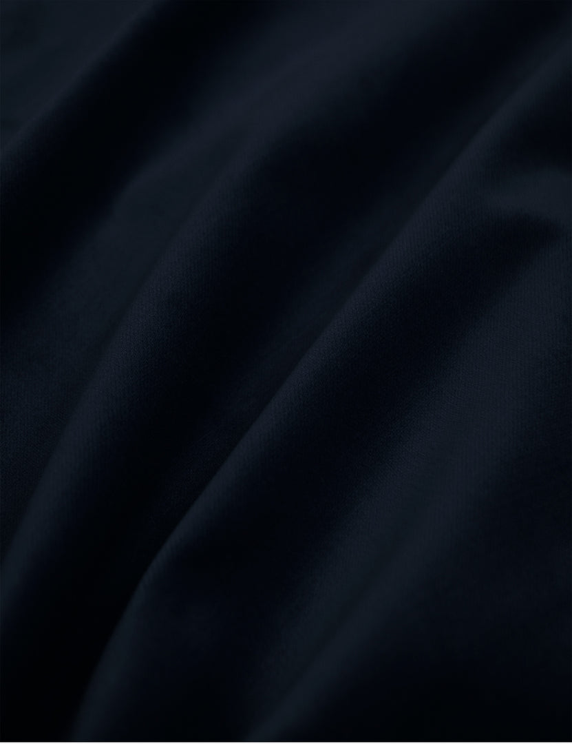 Detailed shot of the navy velvet on the Adara navy velvet upholstered bed.