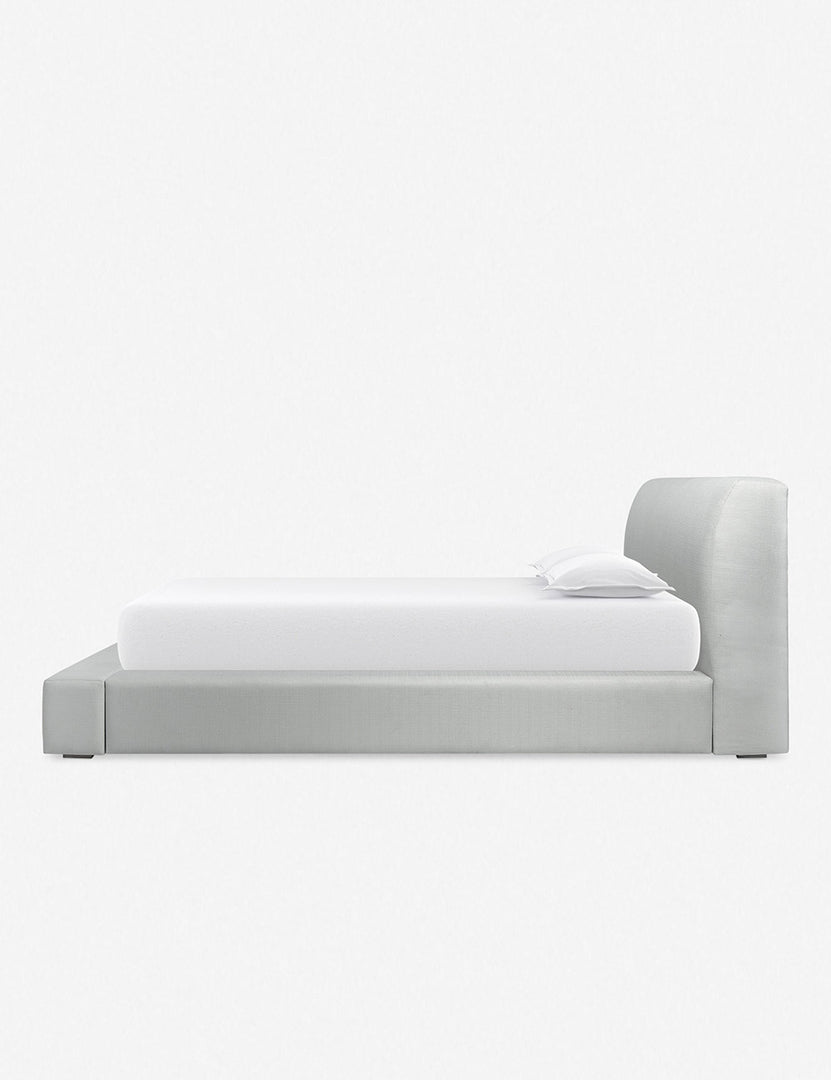 Side view of the Clayton gray upholstered platform bed