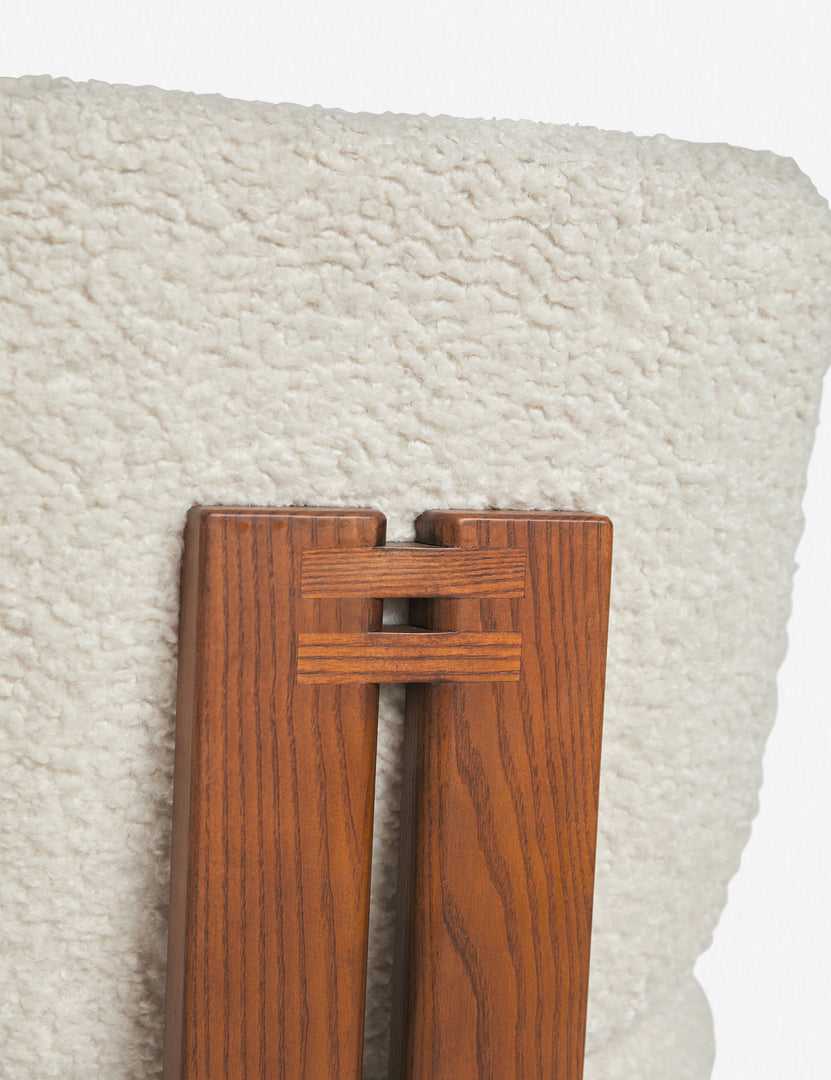 Detailed view of the ash wood back support and plush backing on the back of the Sydney white plush armless dining chair