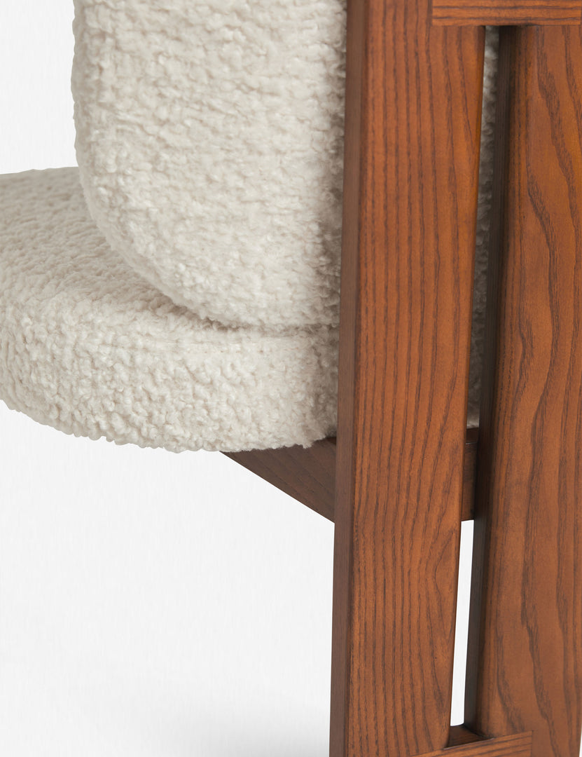 Detailed view of the ash wood back support and plush backing on the Sydney white plush armless dining chair