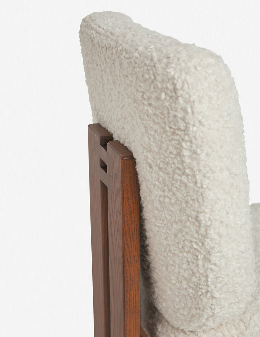 Detailed view of the ash wood back support and plush backing on the Sydney white plush armless dining chair