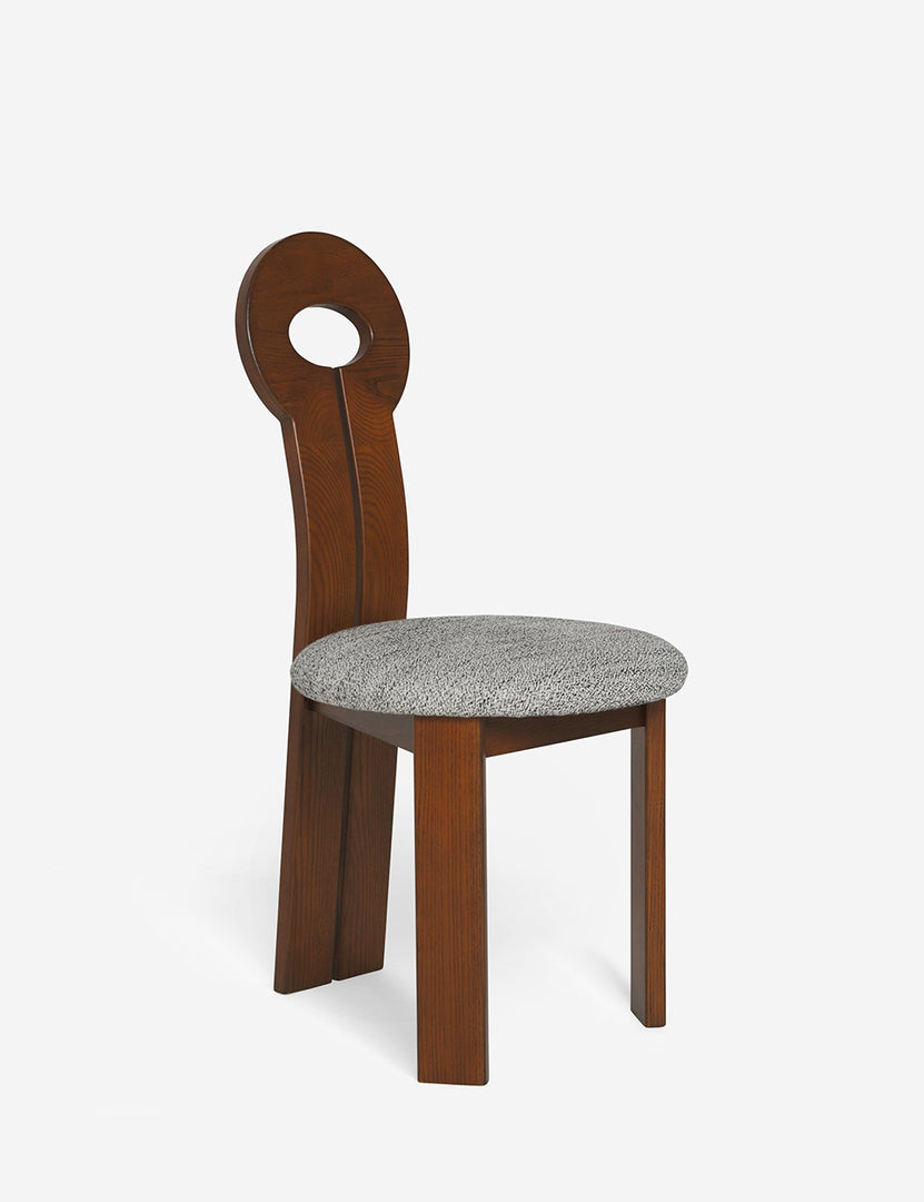 Angled view of the Whit honey wood sculptural dining chair by sarah sherman samuel