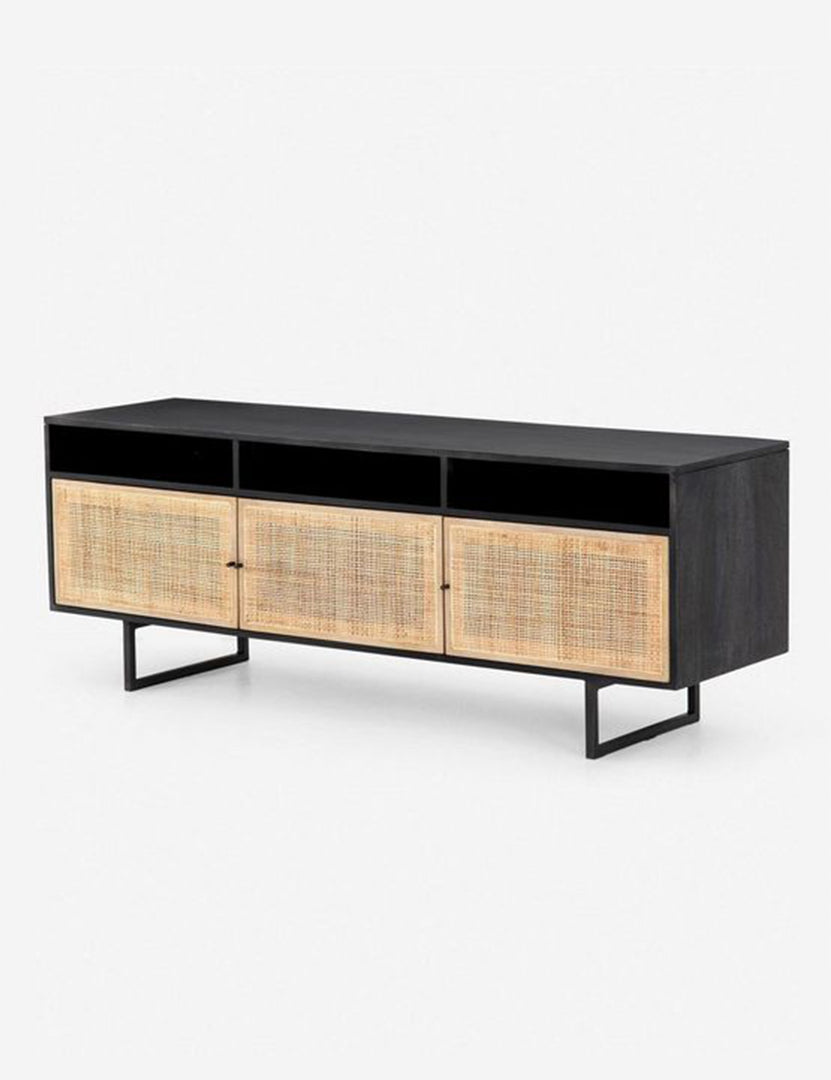 Angled view of the Hannah black mango wood media console with cane doors.