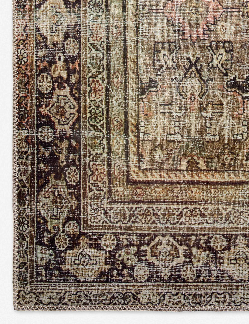 Close-up of the corner of the Dacion distressed dark-toned persian rug