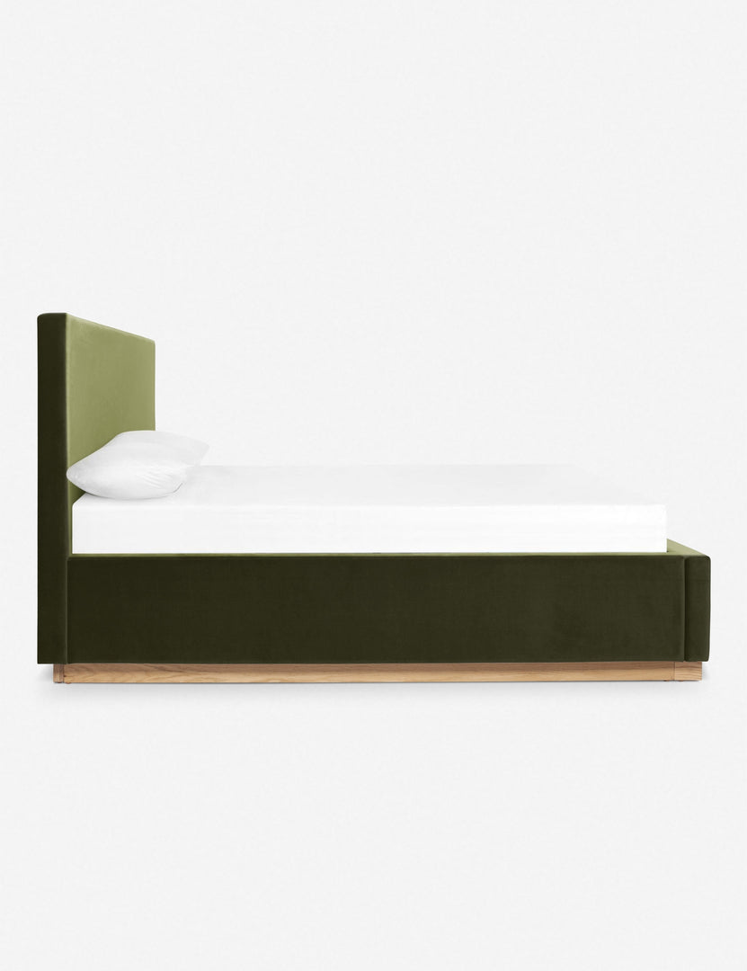 Side view of the Lockwood jade velvet-upholstered bed with a white oak base.