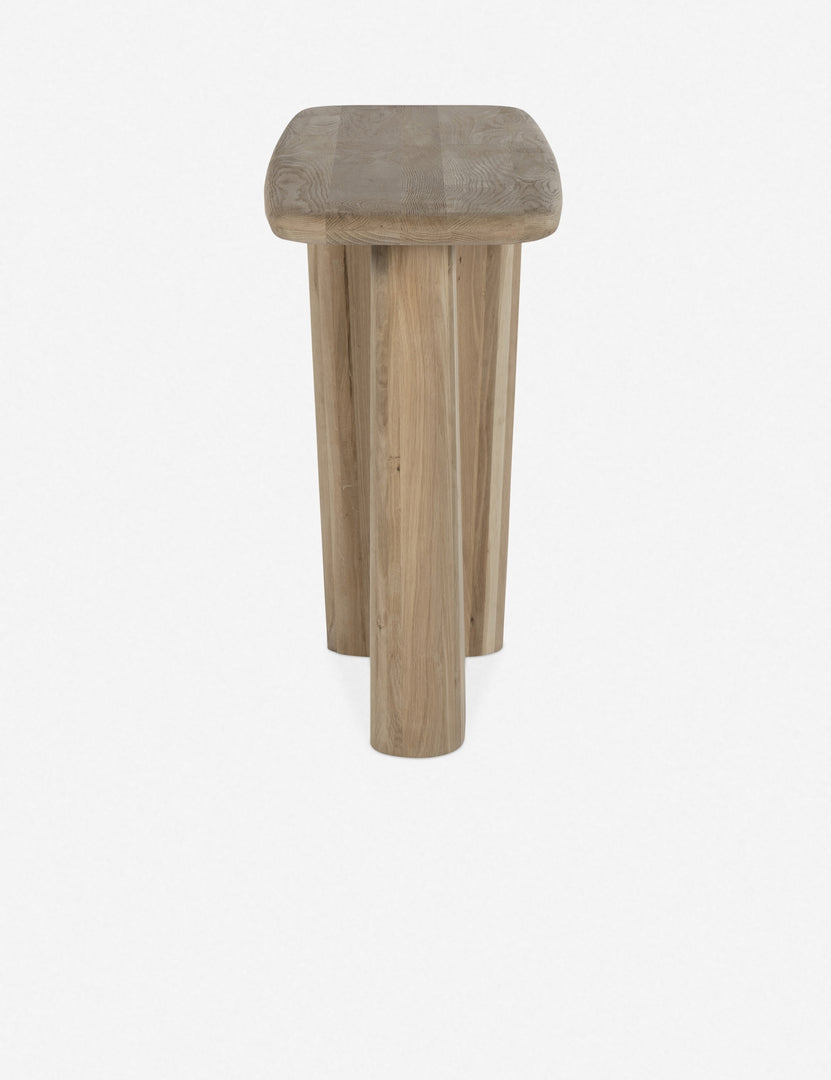 Side view of the Nera natural wood sculptural console table