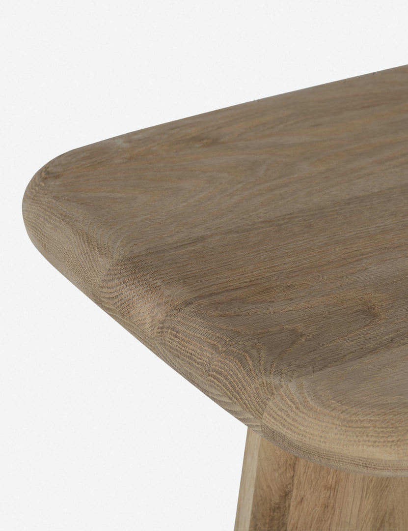 Close-up of the left corner on the Nera natural wood sculptural console table