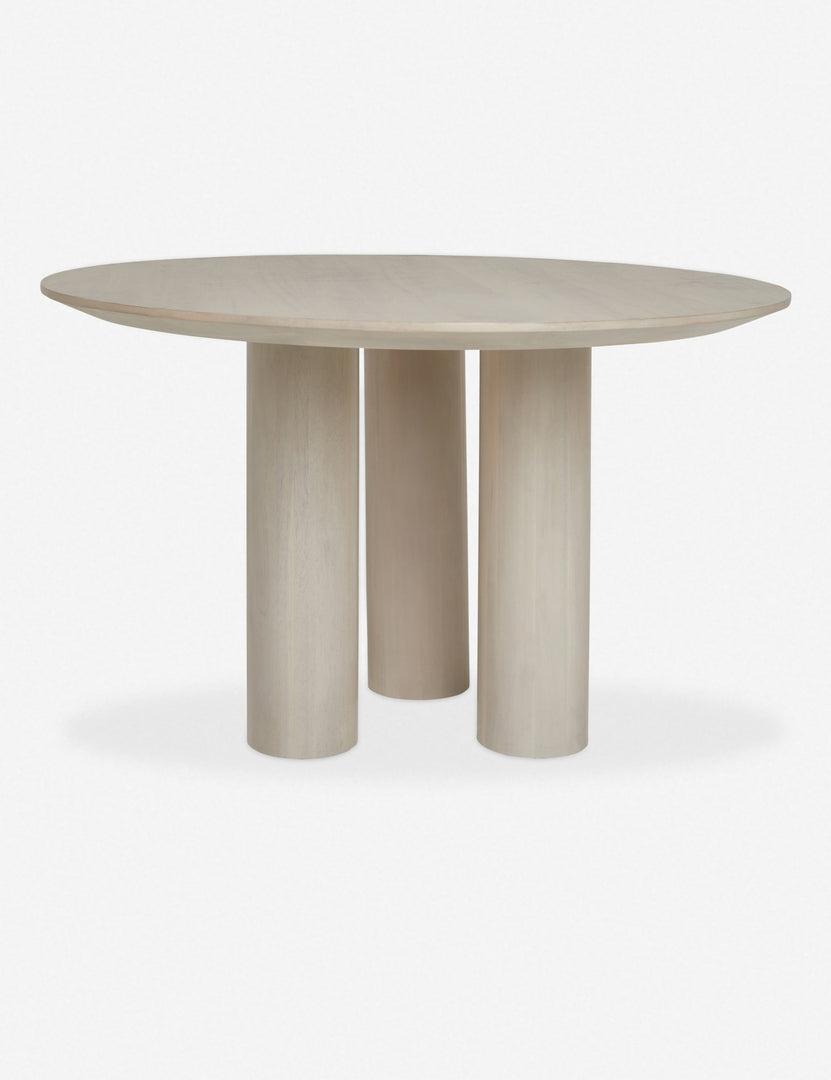 Mojave white round dining table with an architectural base