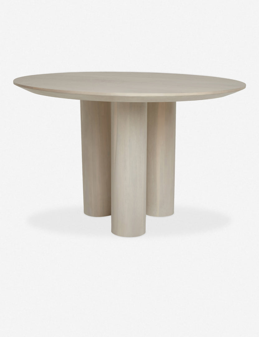 Mojave white round dining table with an architectural base