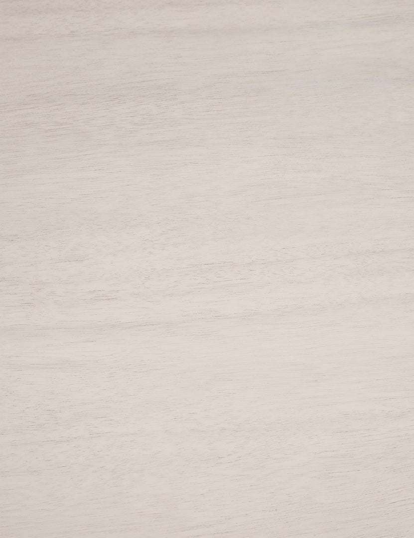 Detailed shot of the white-washed wood on the Mojave white round dining table with an architectural base