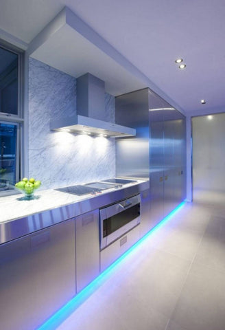 Blue floor lighting in modern industrial kitchen