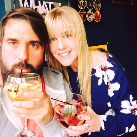 Jim and wife drinking a G&T out of a large copa glass