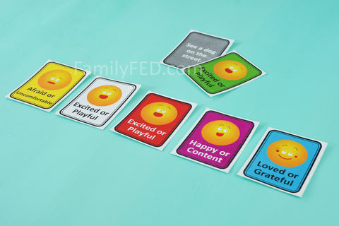 Players guess the person's emotional response in Emoji Emotions game by Family F.E.D.