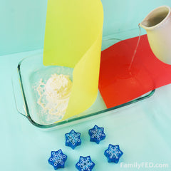 Easy DIY Frozen family game to protect Arendelle’s castle! Pour water toward the flour.