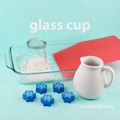 Easy DIY Frozen family game to protect Arendelle’s castle! Try to block it with a glass cup.