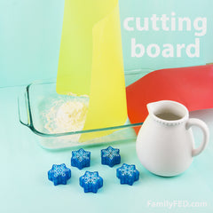 Easy DIY Frozen family game to protect Arendelle’s castle! Try to block it with a cutting board.