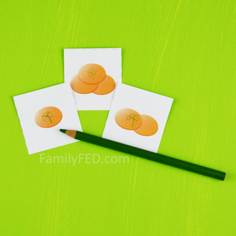 Draw a clover on some coin cards for a bonus turn in the Greedy Leprechaun St. Patrick's Day game by Family FED