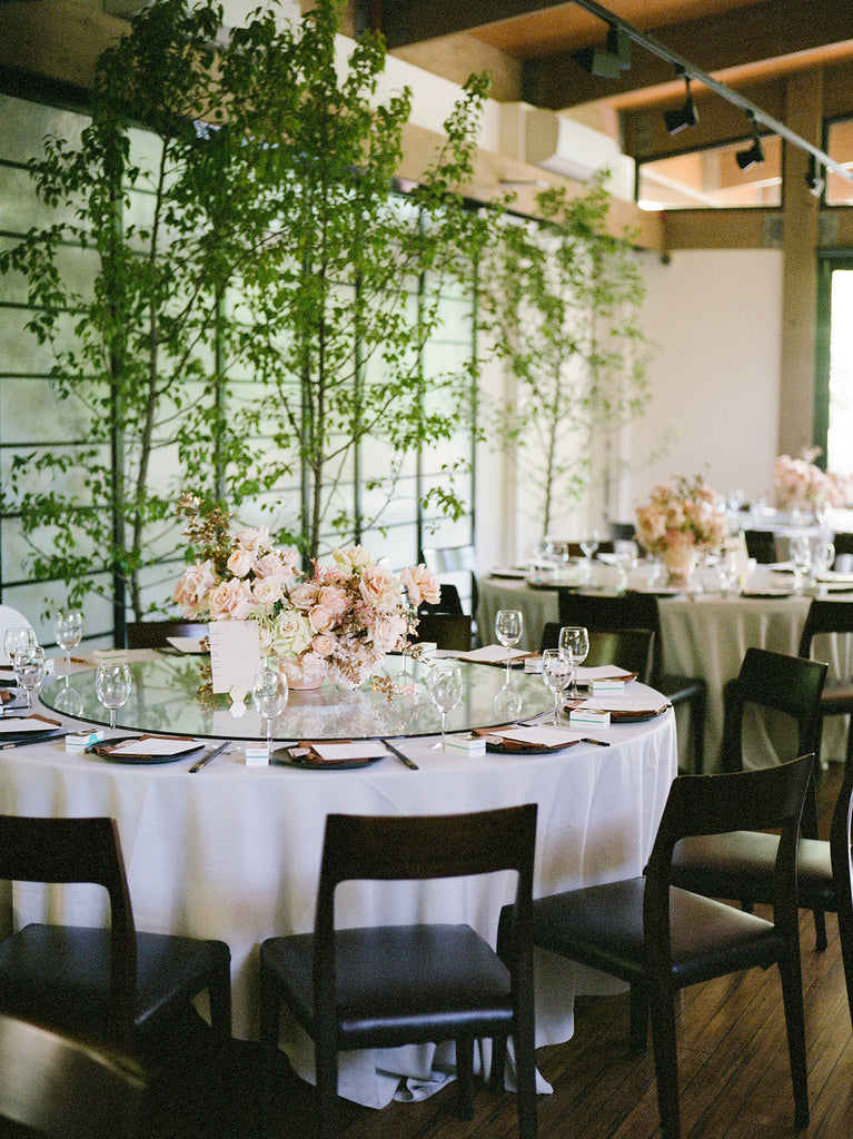 Peach floral wedding table styling