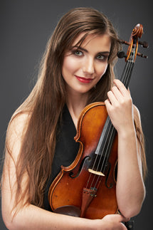 Young woman holding a violin.