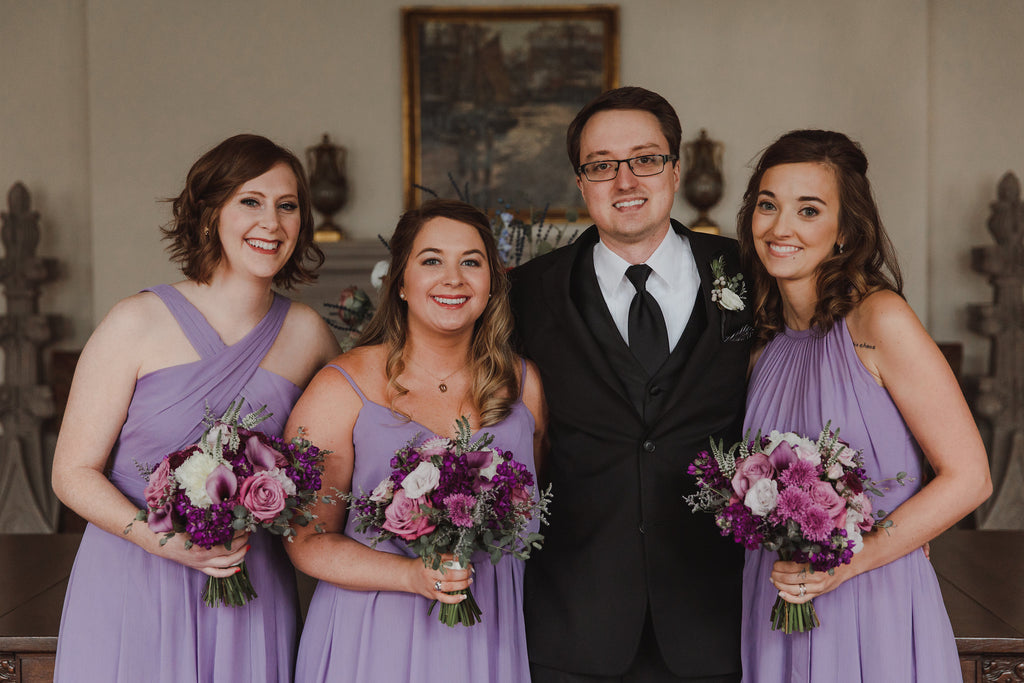 bridesmaids and groom poses