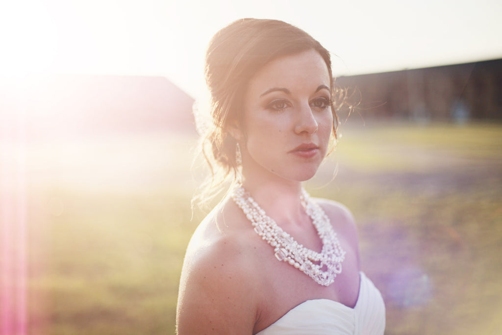 Briana was stunning in her chiffon wedding dress. | A Whimsical Gold and Pink Wedding Day