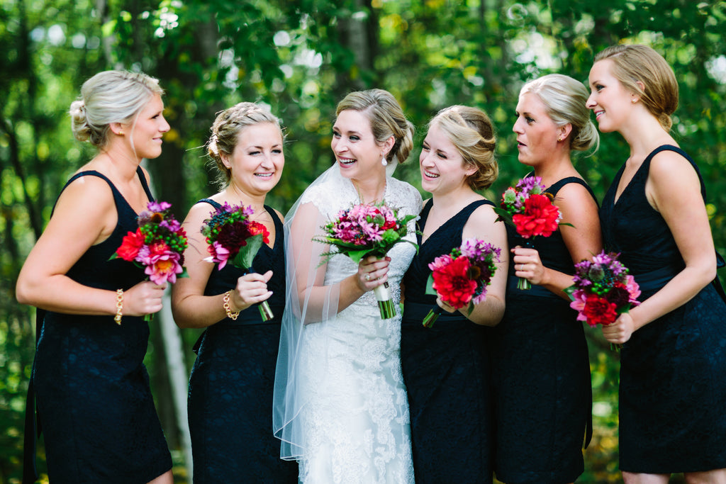 A gorgeous bridal party in navy lace bridesmaid dresses. | A Nautical-Inspired Wedding Day