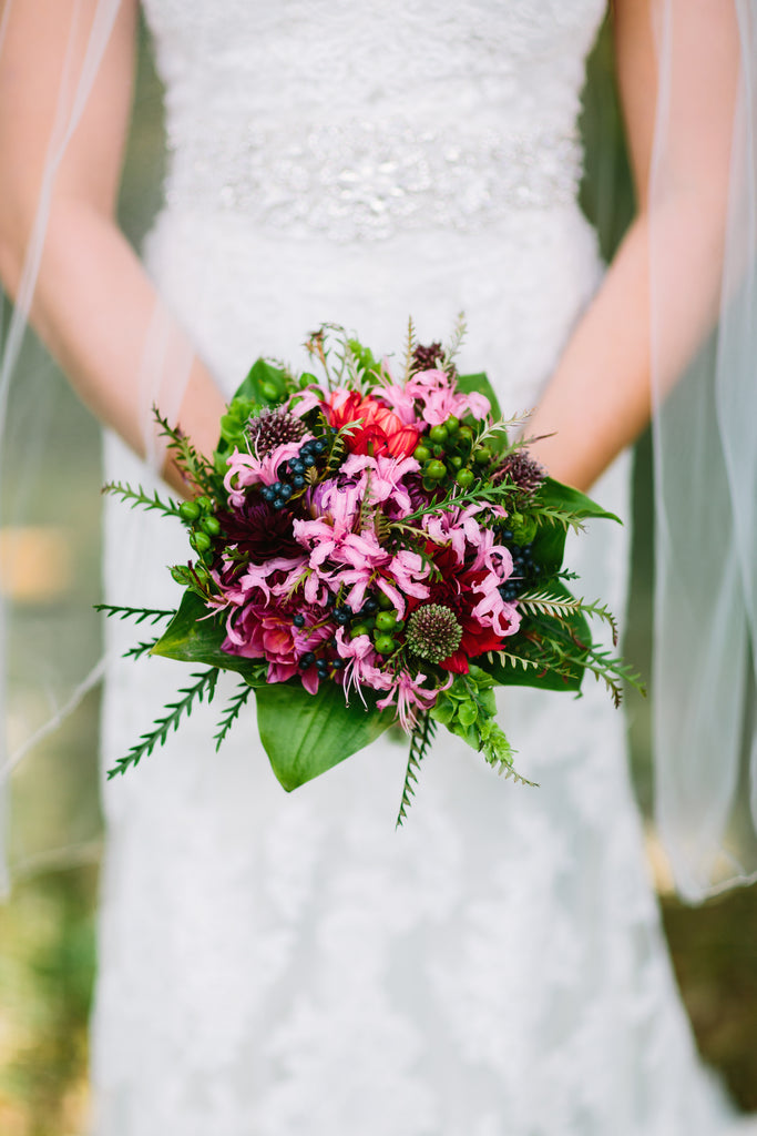 A gorgeous pink and purple bridal bouquet. | A Nautical-Inspired Wedding Day