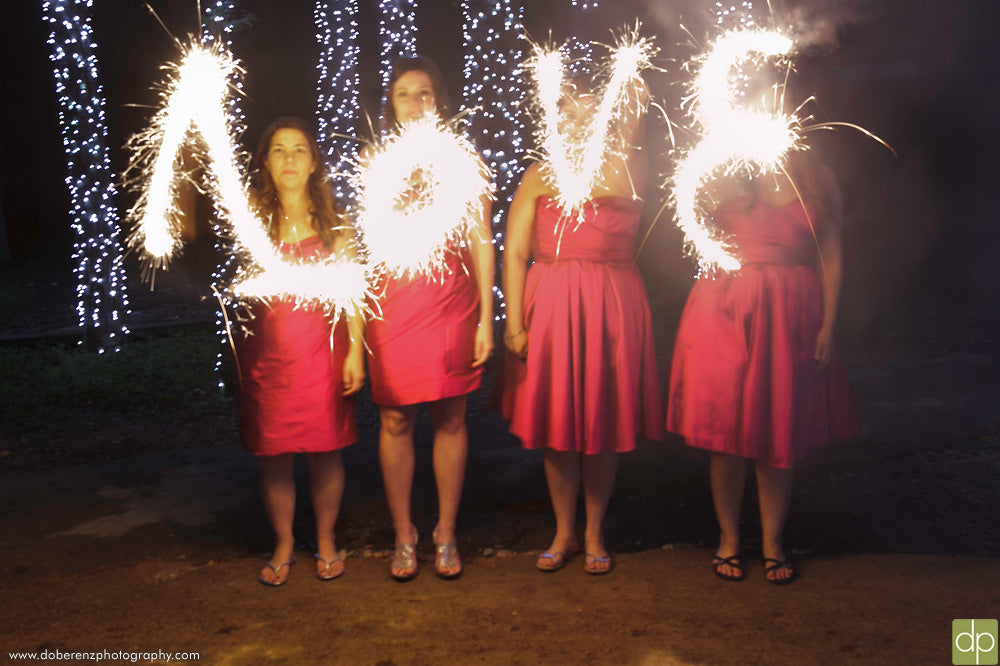 Must-Have Wedding Pictures of Bridesmaids Writing Love with Sparklers
