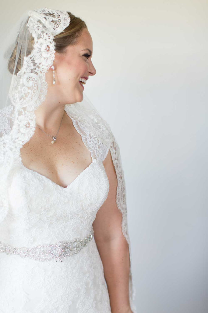 Martha wore a stunning lace-trimmed veil with her lace bridal gown.