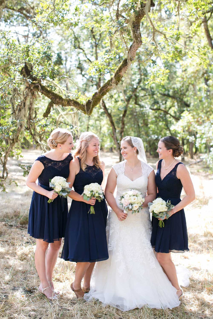 The 'maids wore mix and match navy blue bridesmaid dresses.