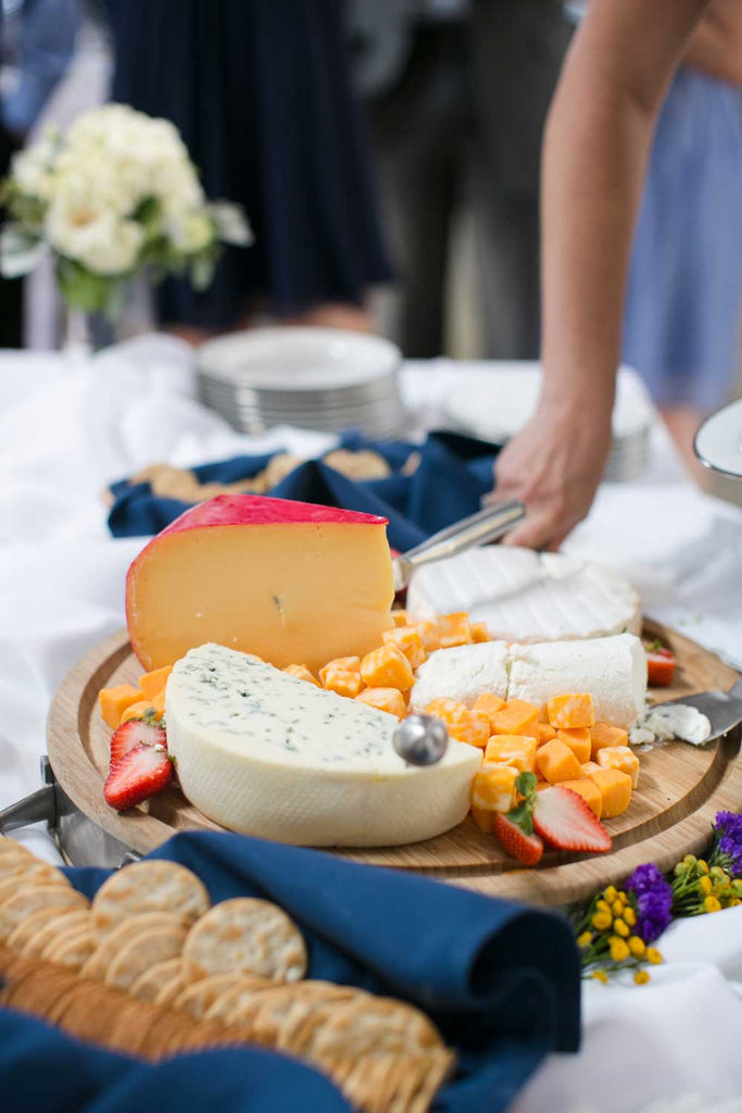 A delicious cheese plate was served at the wedding reception.