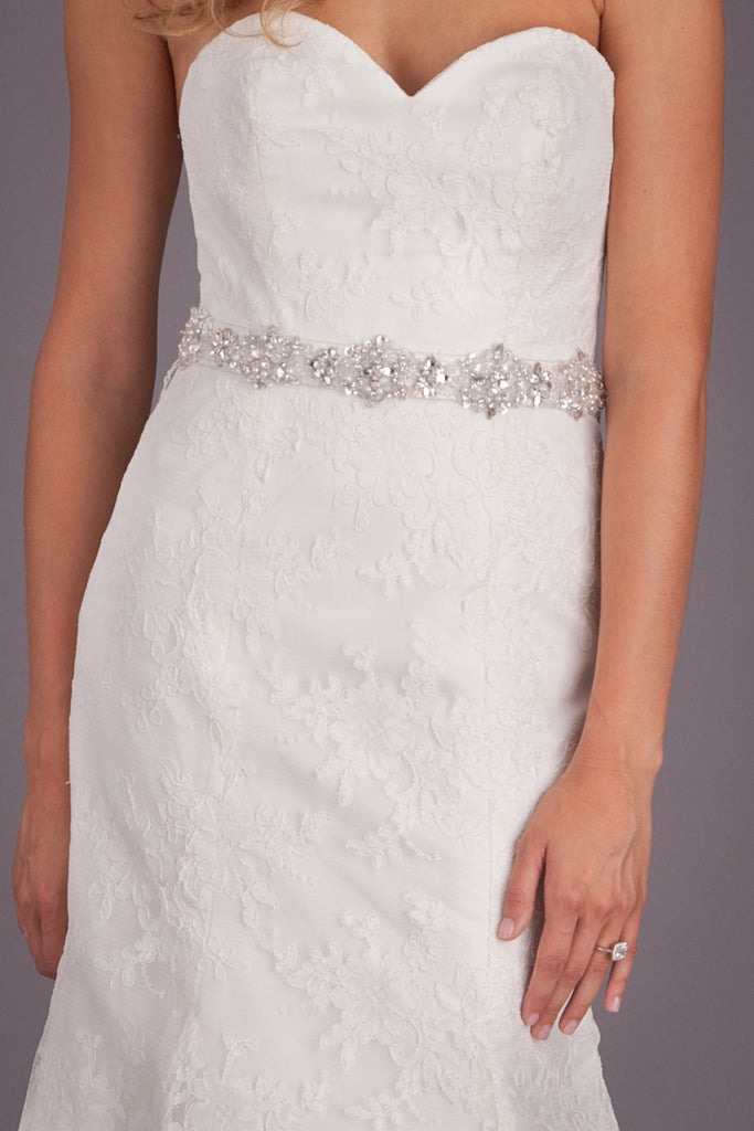 Fall in love with the elegant details of this lace bridal gown. | Featured Style: A Lace Fit and Flare Wedding Dress