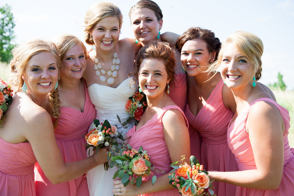Kennedy Blue bridesmaid dresses in coral. | An Outdoor Wedding That’s Simply Charming | Kennedy Blue