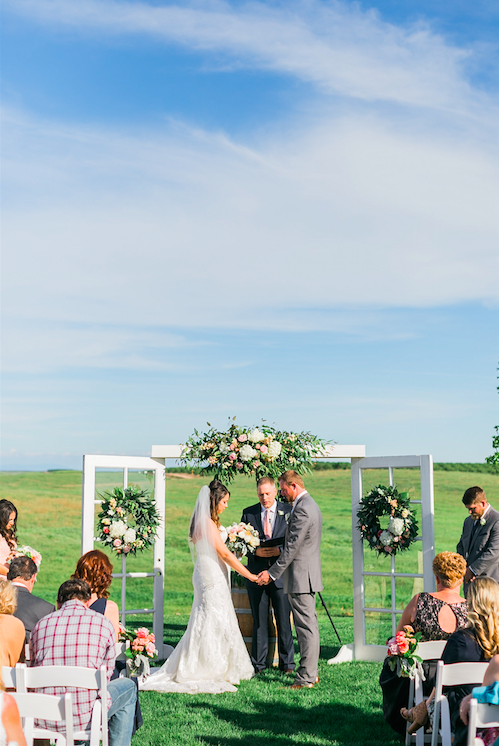 Beautiful photo of the bride and groom getting married! | An Elegant, Blush Pink, Rustic Wedding | Kennedy Blue | Catherine Leanne Photography