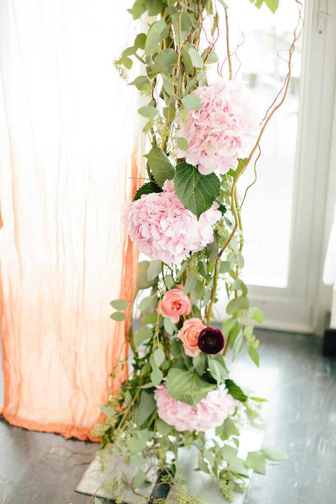 The ceremony backdrop have stunning florals from Thistle & Blooms | Floral Graffiti Inspiration at The Big Fake Wedding