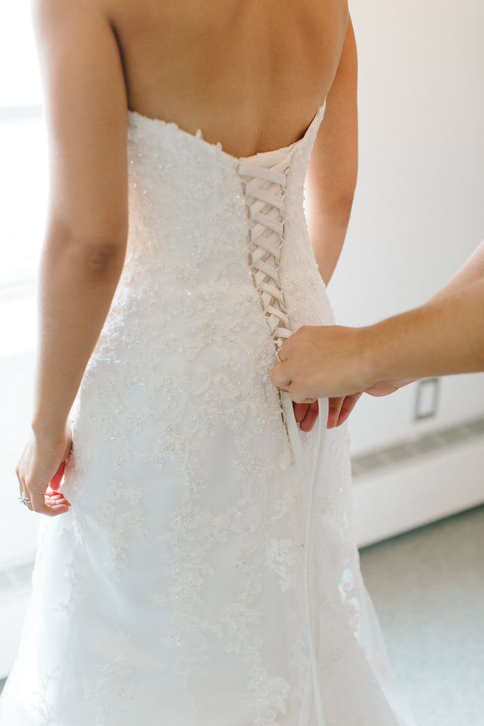 A stunning corset-back lace bridal gown from The Wedding Shoppe, Inc. | Floral Graffiti Inspiration at The Big Fake Wedding