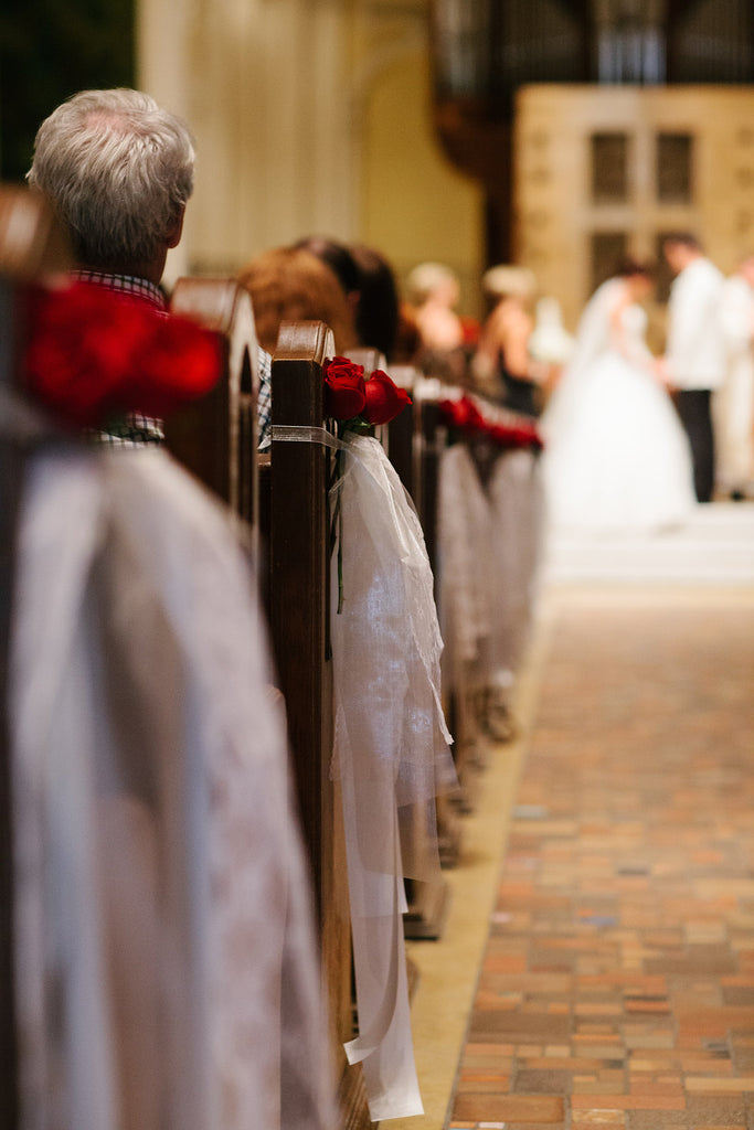 A wedding ceremony held in the Chapel of St. Thomas Aquinas in St. Paul, MN. | A Timeless and Traditional Mansion Wedding