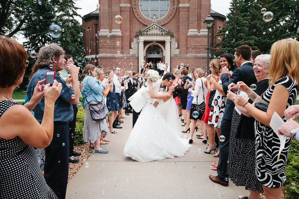 Bubbles were handed out for the couple's ceremony exit. | A Timeless and Traditional Mansion Wedding