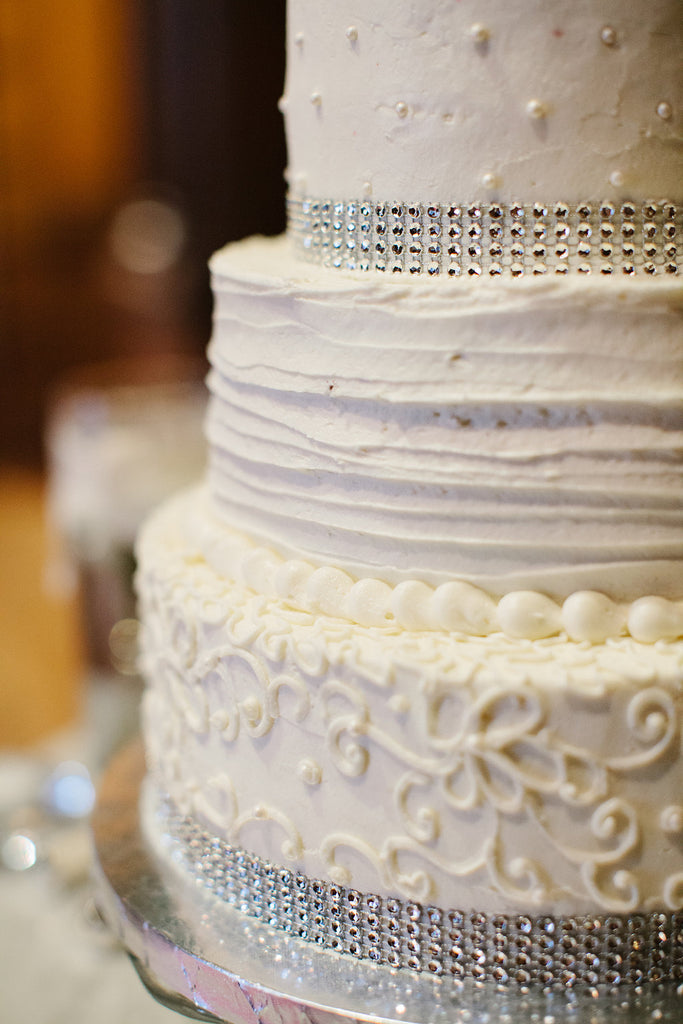 A simple and sparkly white wedding cake. | A Timeless and Traditional Mansion Wedding