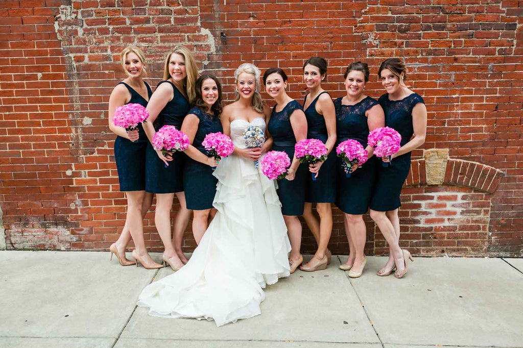 This bridal party looks amazing in their navy lace bridesmaid dresses | A Blue and Pink Rock 'n Roll Wedding