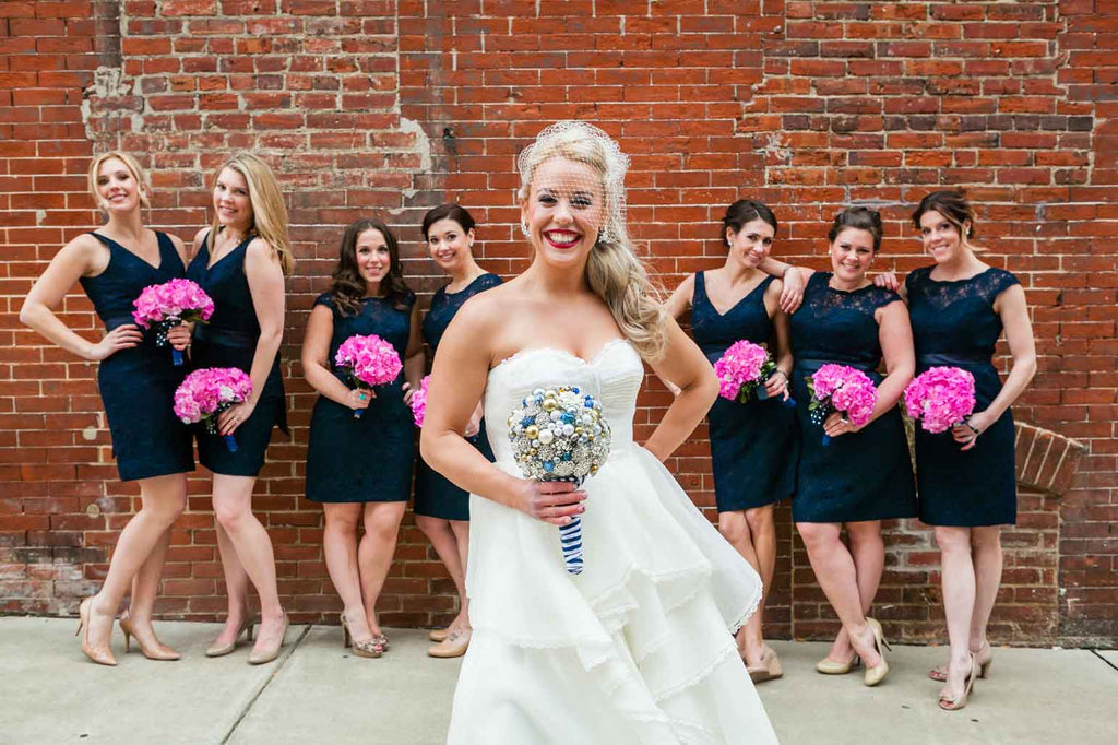 A fun wedding photo of the bride with her bridesmaids | A Blue and Pink Rock 'n Roll Wedding